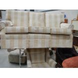 A three seater sofa and chair.
