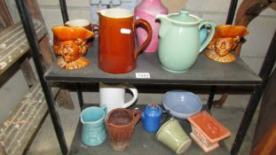 Two shelves of stoneware and pottery jugs including Denby.