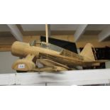 A part built model aircraft in wood (Westland Lysander).