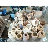A large collection of glazed pots