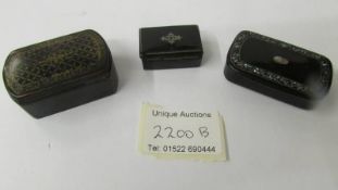 Three Victorian lacquered snuff boxes.