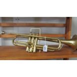 A Melody Maker trumpet with mouthpiece.