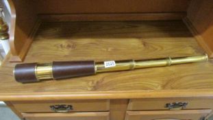 A brass telescope.