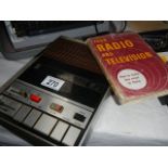 A Microfon tape recorder and a book on radio and television.