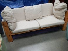 A pine framed sofa.