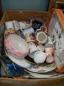 A box of china including plates etc.