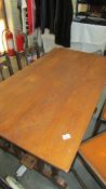 A solid oak refectory style dining table with barley twist legs, 136 x 73 x 77 cm high.