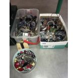 A large quantity of unsorted costume jewellery (2 boxes)
