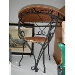 A Wrought iron chair and matching hall table.