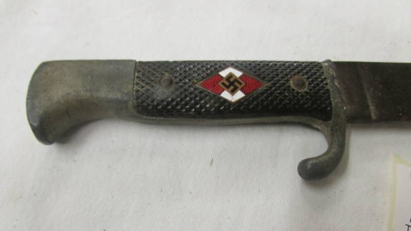 A WW2 German dagger with enamel insignia and stamped RZ M 7/27 1941 on blade. - Image 2 of 5