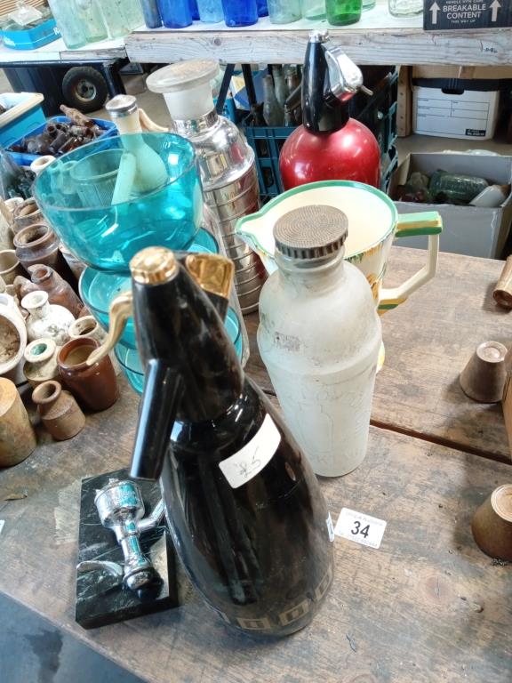 A collection of 50's/60's soda syphons, shakers & jug etc.