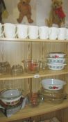 A good lot of Pyrex, jelly moulds, set of Royal Worcester mugs etc.