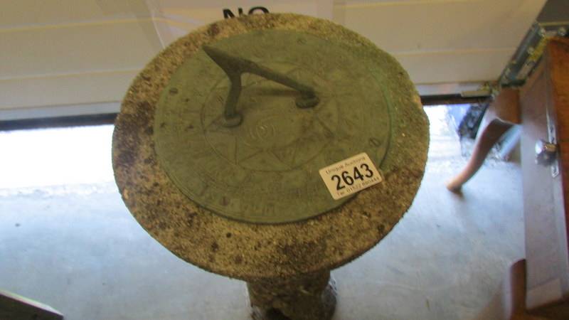 A garden sundial supported by a cherub. - Image 3 of 3