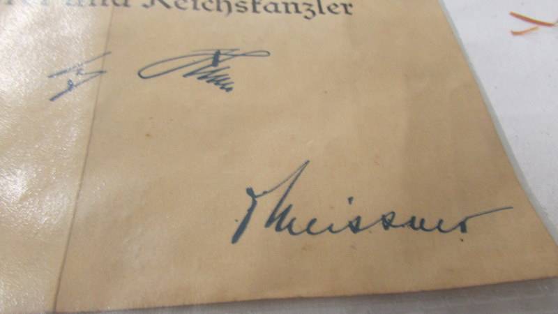 A original WW2 German award document being an SS long service awarded for SS Scharfuhrer Franz - Image 4 of 4