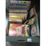 A quantity of vintage children's books including Noddy & a collection of dinosaurs magazines etc.