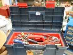 A tool box with assorted tools.