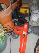 A petrol hedge trimmer and an electric hedge trimmer.