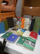 A quantity of old cricket related books.
