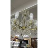 A good brass and glass 6 lamp chandelier.