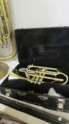 A cased Blessing USA cornet with mouthpiece (needs some attention to valves to enable playing).