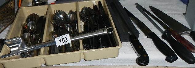 A mixed lot of cutlery including carving implements.