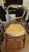 A 1930's balloon back side chair with cane seat.