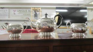 A Three piece silver plate tea set.