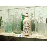 A large collection of various 'name' bottles