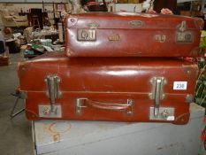 Two vintage suitcases.