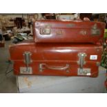 Two vintage suitcases.