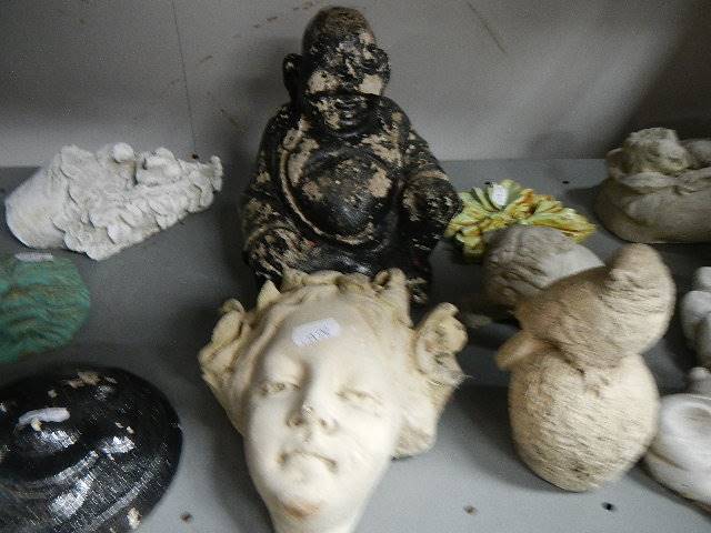 A shelf of garden figures. - Image 2 of 2