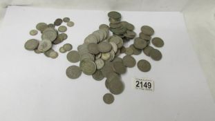 A mixed lot of coins including 110 grams of silver.