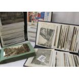 Three small albums of Edwardian and later postcards.