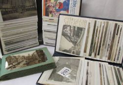 Three small albums of Edwardian and later postcards.