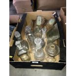 A box of mainly cut glass decanters