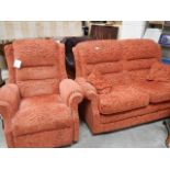 A 2 seater sofa and an electric arm chair.