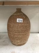 An art pottery lamp base embossed RH