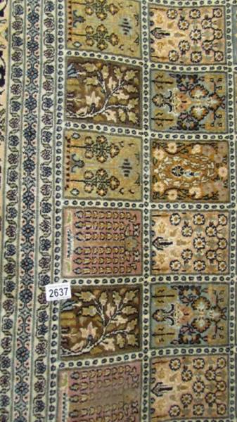 A large fine Indian silk carpet. - Image 2 of 2