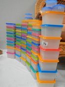 In excess of 50 good plastic storage boxes with coloured lids.