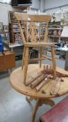 A circular pine kitchen table and one chair, 92 cm diameter, 77 cm high.