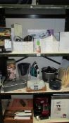 Three shelves of miscellaneous electric and kitchen items.