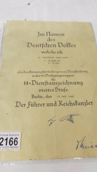 A original WW2 German award document being an SS long service awarded for SS Scharfuhrer Franz