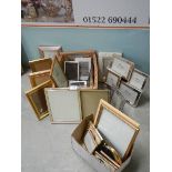 A quantity of new and used picture frames.