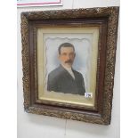 An early 20th century portrait of a man in original frame.