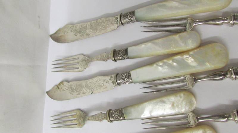 A set of fish knives and forks with mother of pearl handles and silver bands together with other - Image 2 of 4