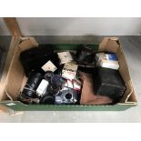 A box of old cameras,