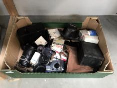 A box of old cameras,