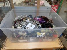 A large quantity of unsorted costume jewellery.