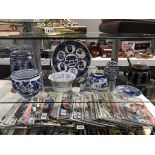 A selection of blue & white pottery including Ringtons lidded jar etc.