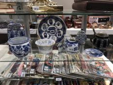 A selection of blue & white pottery including Ringtons lidded jar etc.